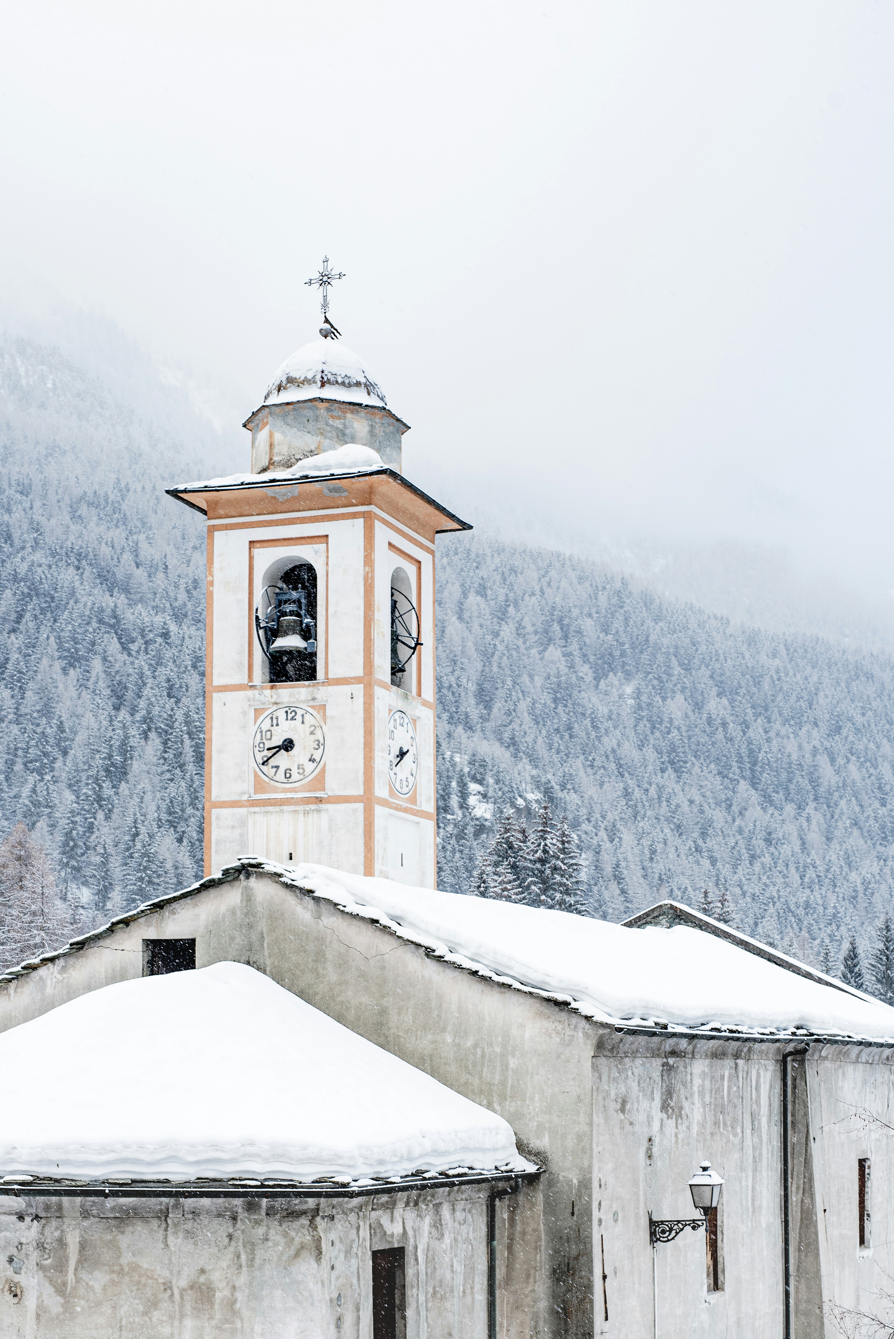 white and brown concrete building on snow covered mountain during daytime